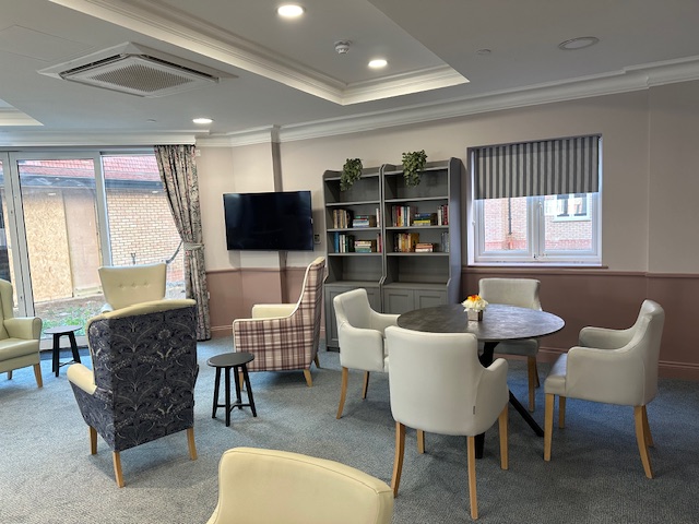 Warm reception area with soft seating