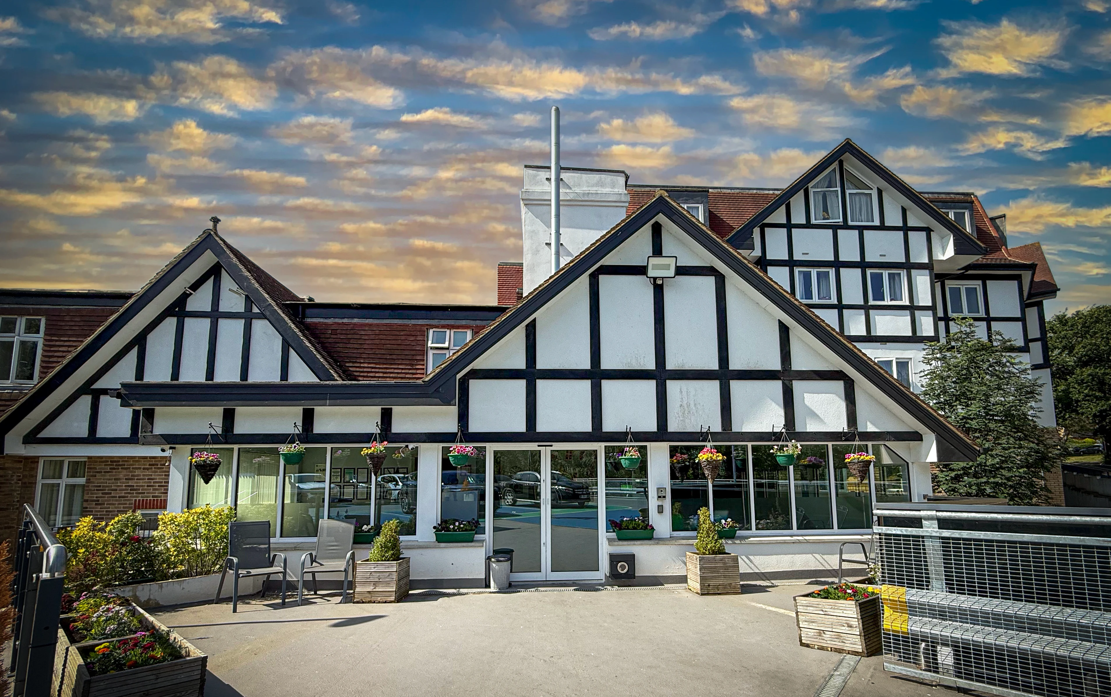 The grand Tudor-style exterior of Forest Place Nursing Home in Buckhurst Hill, Essex